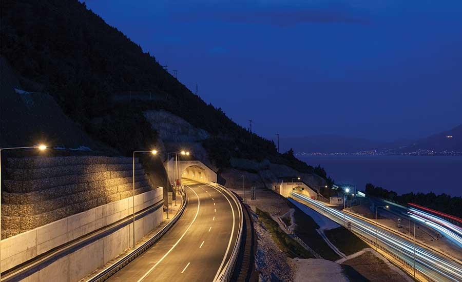 The new motorway frequently intersects with the old national road, requiring significant traffic management during construction.  PHOTO COURTESY OF OLYMPIA ODOS