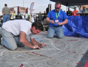 Chris Swanson of Rescue, Calif., demonstrates his artistry skills with decorative concrete by using acid etching and staining techniques to depict a unique cross design on a 10-ft by 10-ft slab.