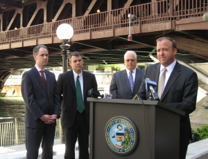 42nd Ward Alderman Brendan Reilly, Chicago, speaks at a celebration of the 90th birthday of the Michigan Avenue Bridge. From left are Brendan Daley, director of green initiatives for the Chicago Park District; Chicago Department of Transportation Acting Commissioner Thomas Powers; and John Chikow, president and CEO of The Greater North Michigan Avenue Association.