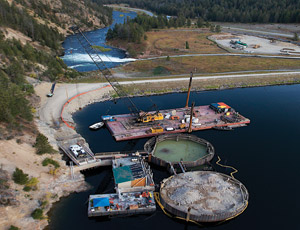 The cofferdam consists of two 16-ft-wide and 80-ft-tall steel cylinders filled with 45,000 cu yd of backfill each. (Photo courtesy of PPL Montana)