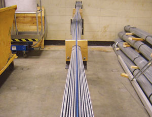 Betti (left) and Khazem handle prefabricated parallel wire strands built for the mock suspension cable that will be subjected to real-life corrosion factors.