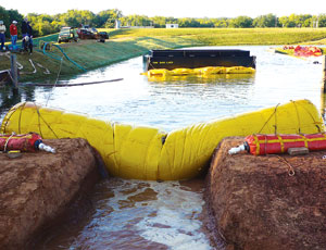 Inventing a Way To Plug Breached Levees With Water-Filled Tubes is Good Fun...and Wonderful