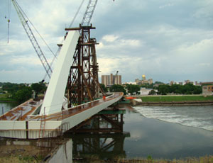 View from the west bank of the Des Moines River; this is one of the two connections where the walkways meet on the Center Street pedestrian bridge.