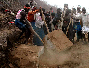 Villagers used muscle-powered levers to remove boulders from road’s path.