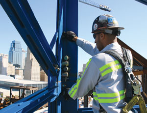 Hague inspects bolts and pins on a J.E. Dunn tower crane working in downtown Kansas