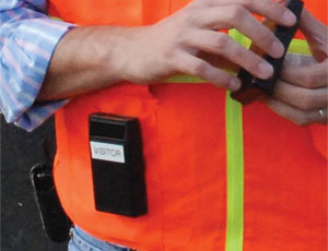 Warning device worn by a worker (below) approaching a danger zone emits a signal picked up by a device in the equipment’s cab (above).