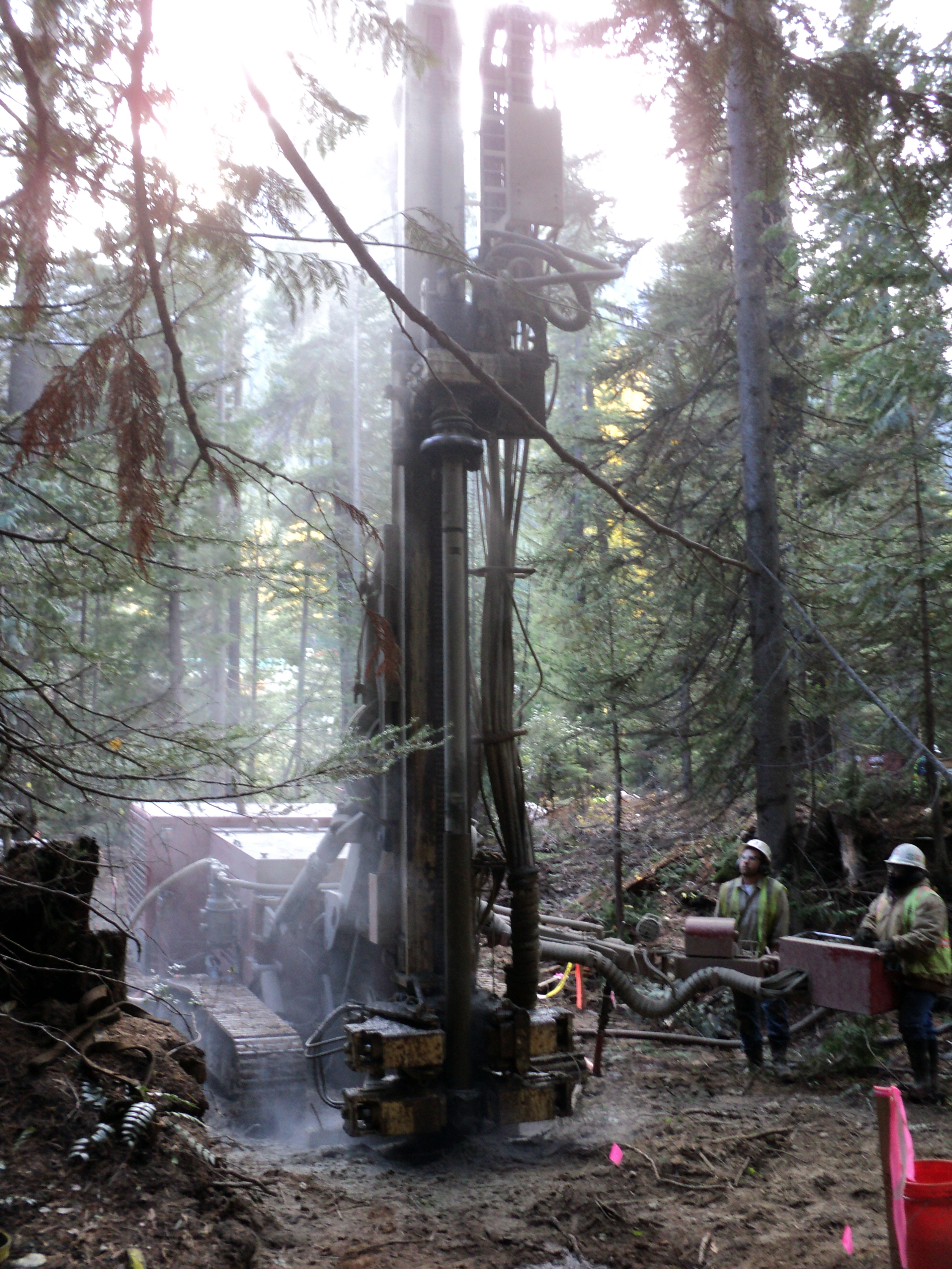 Air Drilling Wells with a Soil-Mec rig with down the hole hammer and underreamer for WellPoint installation at Holden Mine remediation site