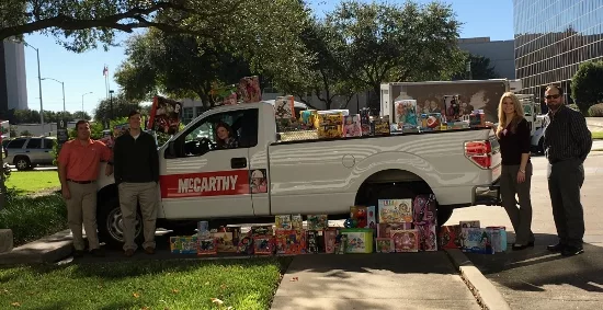 McCarthy-team-members-with-toys
