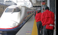 Japanese  train cleaners bow as the Tohoku ShInkansen pulls into Tokyo on April 20, 2011. Photo by Tom Sawyer/ENR