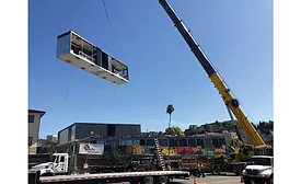 crane lifting a modular piece
