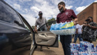 Mayor Lumumba joined volunteers who distributed millions of bottles of water