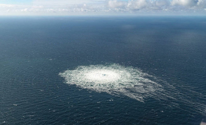 Seen from above, a white circle, containing methane, spreads out in the dark blue waters of the Baltic Sea 