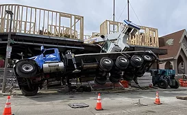 Mobile crane falls onto job site in Boston