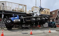 Mobile crane falls onto job site in Boston