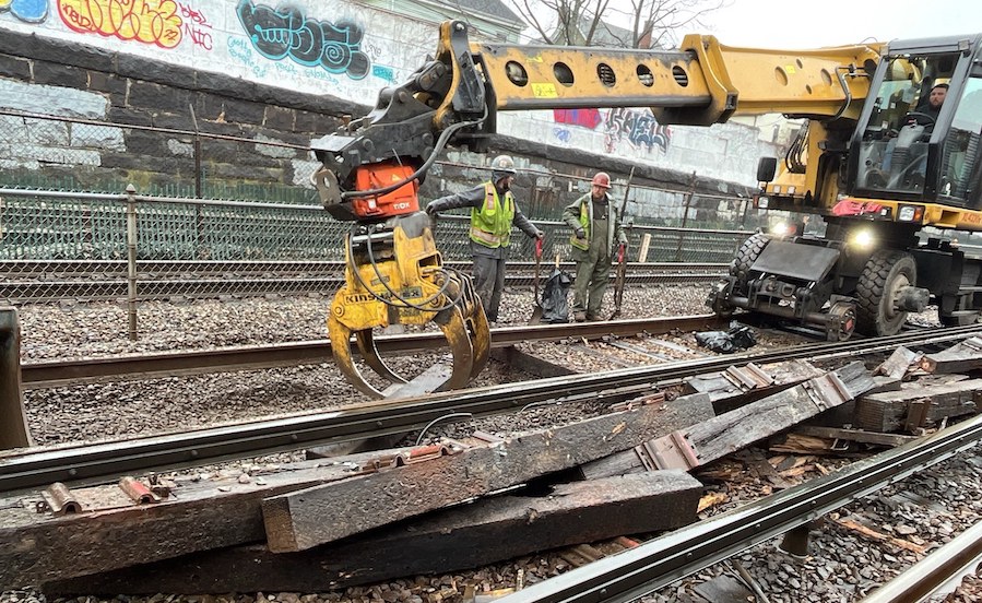 MBTA workers work on train tracks