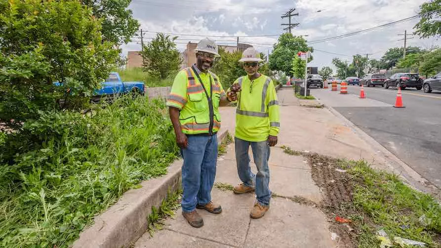 Two RK&K workers dap for a photo