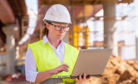 construction worker with a laptop