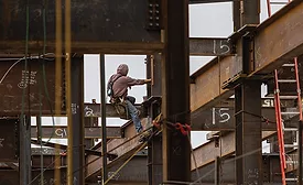man on a steel girder 