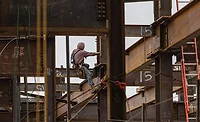 man on a steel girder 