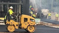 A paving crew at work.jpeg A paving crew at work.jpeg