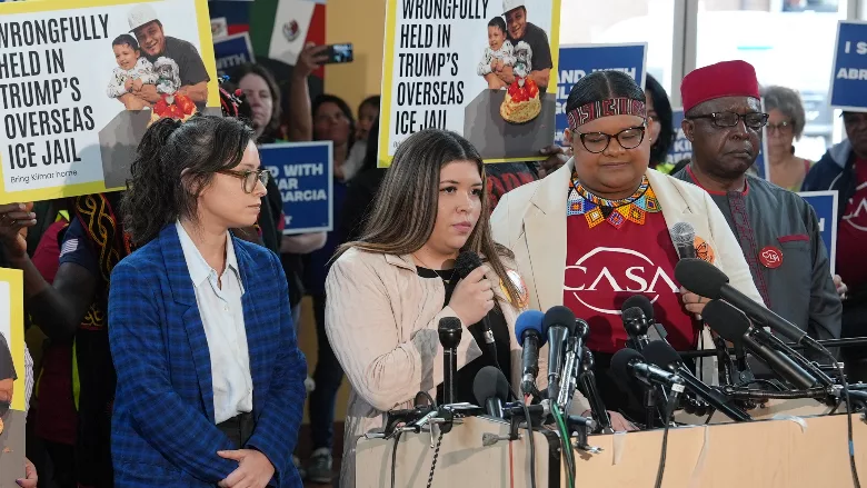 Jennifer Vasquez Sura speaks at a rally with union workers and immigration advocates