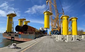 wind turbine equipment is loaded by crane onto a vessel at the South Brooklyn Marine Terminal.jpg