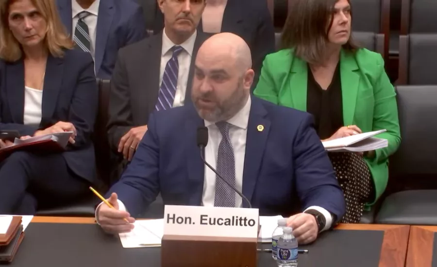 Garrett Eucalitto speaks at a desk in a congressional hearing.jpg