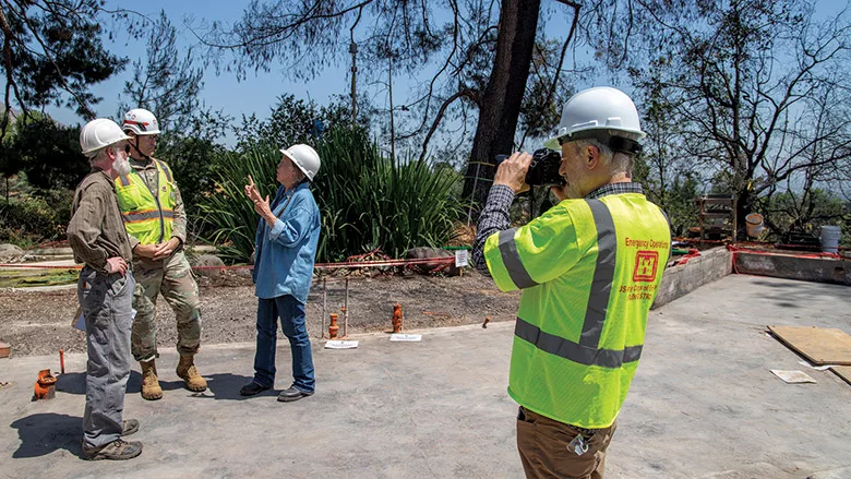Corps and homeowners at an Altadena fire cleanup location