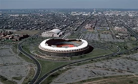 RFK Stadium and its roughly 174-acre campus, shown in an aerial view looking west toward the U.S. Capitol.