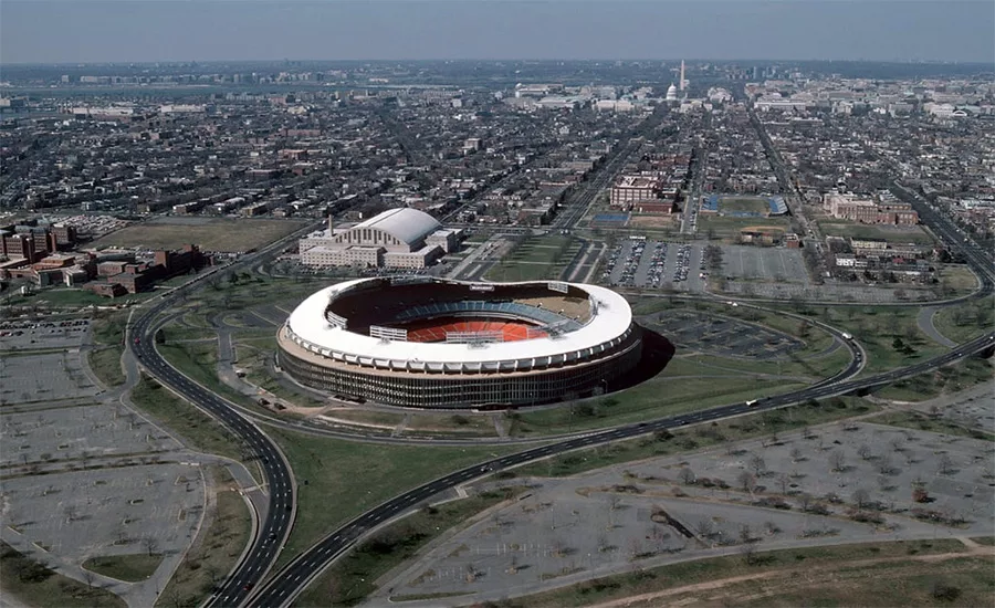 RFK Stadium and its roughly 174-acre campus, shown in an aerial view looking west toward the U.S. Capitol.