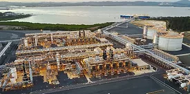Landscape shot of Gladstone LNG plant situated near a body of water