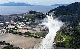 Aerial view of the Grand Ethiopian Renaissance Dam showing water discharging from spillways into the Blue Nile after inauguration.