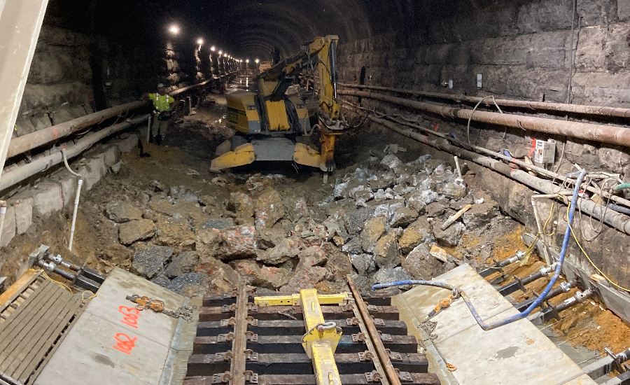 A Brokk demolition robot is seen amid debris in the Howard Street Tunnel