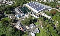Aerial view of PRASA’s Mayagüez wastewater plant, where Jacobs will design a 1.1-mile ocean outfall replacement under a FEMA-funded resilience program.