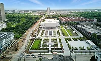 Aerial photo of the Ismaili Center Houston with surrounding gardens and construction along Allen Parkway.