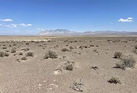 BLM ESMERALDA SOLARSITE Photos shows the desert site of the planned Esmeralda project, with a strip of mountains on the horizon.