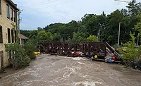 FEMA Story - Wisc.jpg Flooded railroad bridge over swollen river in Wauwatosa, Wisconsin, after August 2025 storms that led to a denied FEMA aid request.