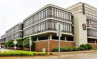 Eos Move to Pitt.jpg Exterior view of Nova Place in Pittsburgh, a modern mid-rise office complex with rounded glass façades and concrete framing that will become Eos Energy Enterprises’ new headquarters.