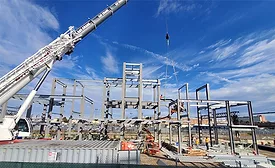 Workers install steel framing for a new Bronx Metro-North station under the delayed Penn Station Access project.