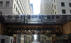 An Orange Line train approaching Quincy in the Loop in downtown Chicago.