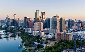 Aerial view of downtown Austin showing the cluster of new high-rise towers exceeding 350 ft along the Colorado River.  
