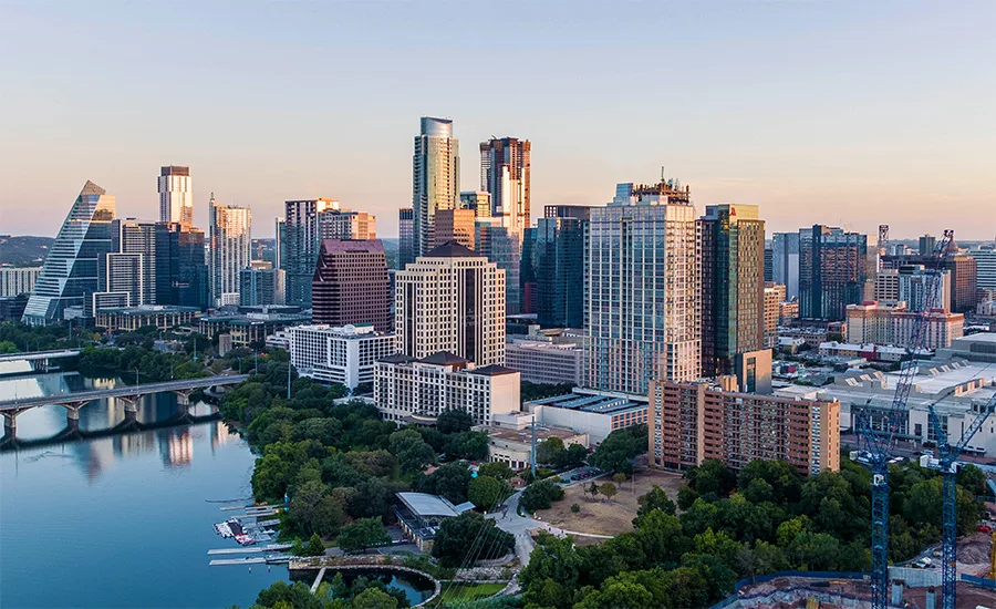 Aerial view of downtown Austin showing the cluster of new high-rise towers exceeding 350 ft along the Colorado River.  