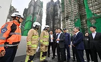 Hong-Kong-Apt.-Block-Fire Hong Kong Chief Executive John Lee visited Wang Fuk Court in Tai Po on Nov. 27 to inspect the fire scene.