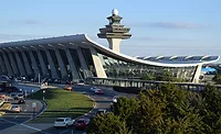 Main terminal at Washington Dulles International Airport with its iconic curved roof and control tower.