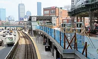 A view of the Lansdowne station and adjacent construction over the Massachusetts Turnpike, highlighting the air-rights deck area connected to the Fenway Center project.
