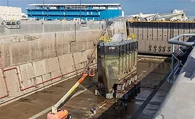 Dry dock section being inspected at a Navy shipyard undergoing modernization to expand maintenance and industrial-base capacity.