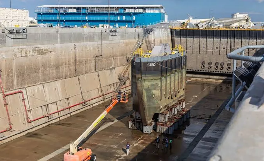 Dry dock section being inspected at a Navy shipyard undergoing modernization to expand maintenance and industrial-base capacity.