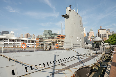 U.S. Navy submarine at an aging shipyard facility.