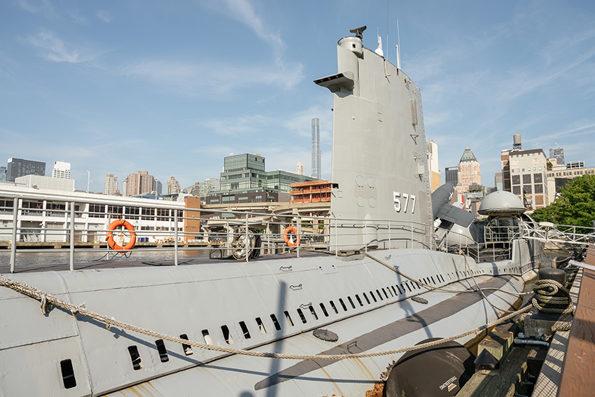U.S. Navy submarine at an aging shipyard facility.
