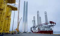 Offshore wind turbine components and installation vessels at a U.S. East Coast port.